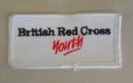 White cloth flash with the words 'British Red Cross Youth' in black and red.
