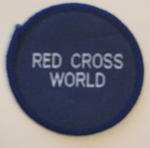 Circular navy cloth badge: Red Cross World. To be sewn on to uniform.