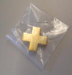 Small gilt-coloured emblem badge