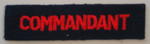 Cloth flash, red letters on navy blue: COMMANDANT
