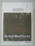 Small grey plastic bag with the words British Red Cross in white, reflecting the new style of branding introduced in 2006.