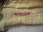 Cotton gift bag with draw string. Cloth label sewn inside: 'Red Cross & St John War Organisation London'.