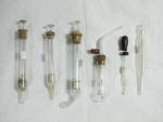 Assorted syringes and surgical glassware