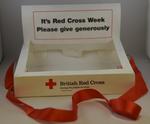 Plastic collection tray: 'It's Red Cross Week. Please give generously'