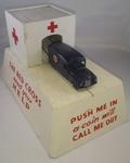 British Red Cross mechanical collecting box with roll out model ambulance: 'Push me in - a coin will call me out'