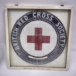 Framed mosaic featuring the Red Cross emblem