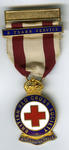 3 Year service badge suspended from red and white ribbon, with additional 3 year bar.