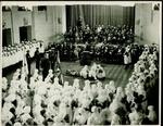 photograph of a first aid demonstration which is taking part in a large hall