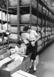 Two British Red Cross youth members packing food supplies in a store to send to Lebanon during the Appeal
