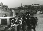 Crowd around a Red Cross vehicle in Lebanon