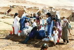 Kurdish women and children collecting water at a refugee camp