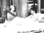 HRH Princess Elizabeth visiting patient in a Red Cross hut used for treating tuberculosis patients.