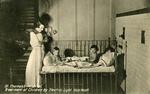 Postcard of young children receiving electric light treatment at St Thomas's Hospital