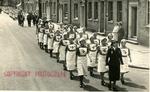 Two Groups of VADs from the Farnham Division, Surrey, marching in the Street