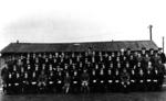 Personnel assembled for a group photograph at a training course at the anti-gas school in Winterbourne Gunner, Wiltshire