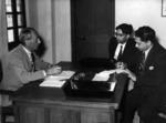 Black and white photograph. British Red Cross Commissioner during an interview with the Pakistan Government publicity officer