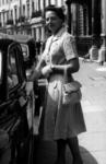 Miss Barbara Miles outside Grosvenor Crescent in London
