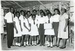 Junior Red Cross members with senior Red Cross members from the Antigua Branch of the British Red Cross