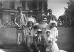 Wounded soldiers with one Red Cross nurse in uniform, four children and two women outside Red Maids Hospital, Bristol