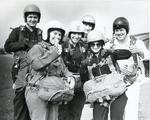 Black and white photograph used in Red Cross News of volunteers from Merseyside branch about to do a parachute jump