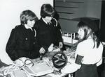 Black and white photograph from Red Cross News June 1976 of cadets from the Hertfordshire branch at a jumble sale