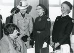 Black and white photograph from Red Cross News of Princess Anne meeting Lesley Ransay and Jennie Pidgeon from Swanage March 1984