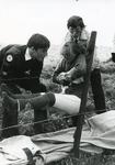 Black and white photograph of First Aid in action