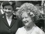 Queen Elizabeth The Queen Mother with a member of the British Red Cross.