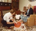 Colour photograph of nursing in the home