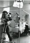 Black and white photograph of filming by London Weekend Televsion of a film requesting volunteers for the Beauty Care service