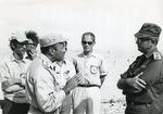 Black and white photograph for World Red Cross Day 1977 of an Egyptian and Israeli officer meeting in no-man's land in 1973
