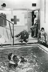 Black and white photograph for World Red Cross Day 1981 - American Red Cross teaching disabled children to swim at the Kennedy School in New Jersey