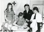 Black and white photograph of Youth and Juniors from County of Avon learning infant care