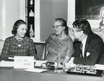 Black and white photograph of Mrs William Whitelaw, Dame Anne Bryans and Sir Evelyn Shuckborough at an Executive Meeting at NHQ