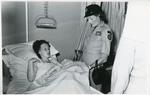 Black and white photograph of Lady Mountbatten on tour of a British Military Hospital in Tripoli