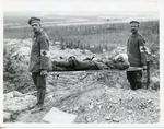 Black and white photograph of a German stretcher bearer with a British casualty during the First World War