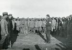 Black and white photograph of an ICRC delegate visiting German prisoners of war during the First World War