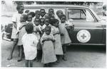 Black and white photograph of Malawi children with clothes from the British and Canadian Red Cross