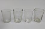 Four glass measuring beakers
