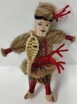 Small woollen doll dressed as a Russian Cossack