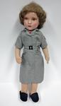 Doll dressed in the uniform of a Hospital Library Service worker