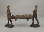 Hand painted model of two stretcher bearers carrying a stretcher