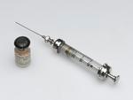 Bottle for diphtheria vaccine with a hypodermic syringe